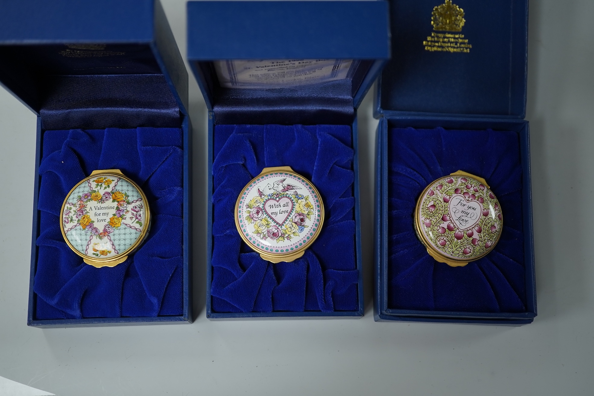 A collection of fourteen boxed Halcyon Days enamel trinket boxes, boxed